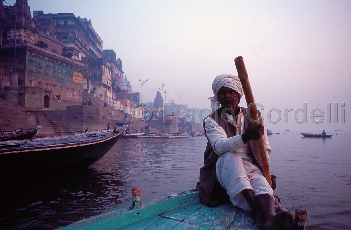 Boatman on the Holy River Ganges (Ganga), Varanasi (Benares), India
 (cod:India 61)